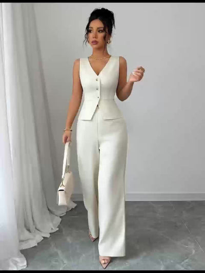 Elegante blouse en broekset met clutch,